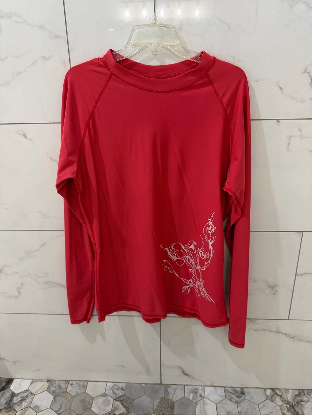 Women’s Long Sleeve coral color Performance Top with Floral Detail SPF 50
